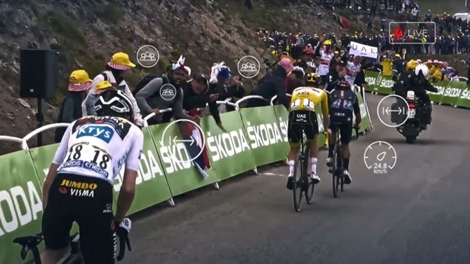 Tour de France cyclists cycling past fans on the road