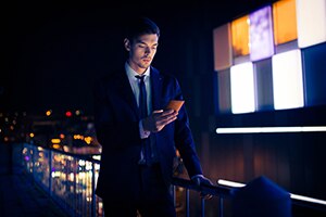 Businessman at the rooftop using mobile phone