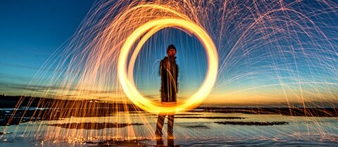 Man making a circular light trail
