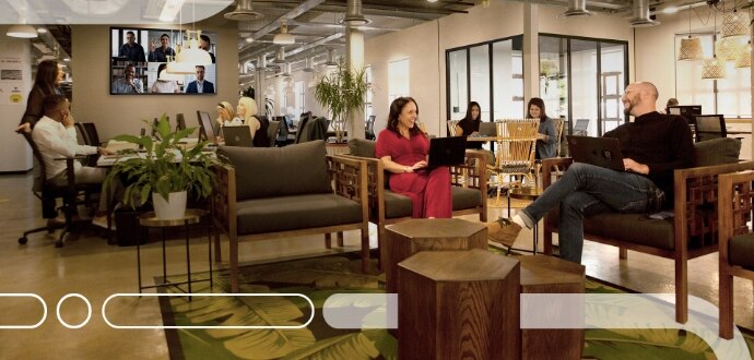 Group of people in an open office lounge area
