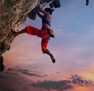 Rock-climber climbing a rock face